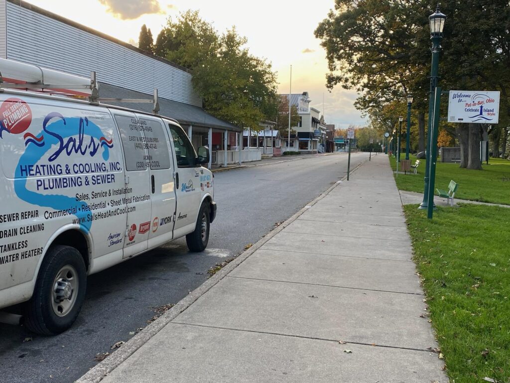 Sal's Heating & Cooling, Plumbing & Sewer white truck parked on street